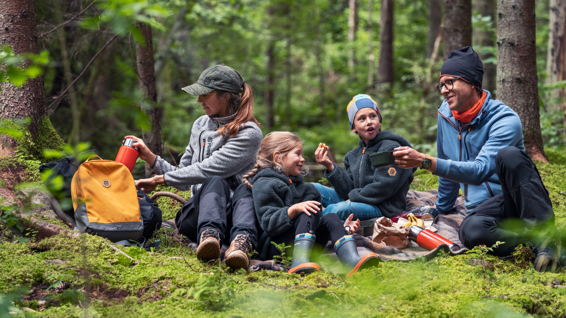 family with xplorer gear in forest